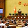 Quốc hội biểu quyết thông qua Luật sửa đổi, bổ sung một số điều của Luật Điều ước quốc tế. (Ảnh: Doãn Tấn/TTXVN)