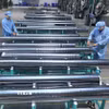 Chế tạo vật liệu sản xuất pin năng lượng mặt trời tại Công ty Trách nhiệm hữu hạn JA Solar Việt Nam, vốn đầu tư của Hong Kong (Trung Quốc) tại khu công nghiệp Quang Châu (Bắc Giang). (Ảnh: Danh Lam/TTXVN)