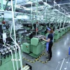 Dây chuyền sản xuất vải dệt kim tại Công ty TNHH Best Pacific Việt Nam, vốn đầu tư của Hong Kong (Trung Quốc) tại khu công nghiệp VSIP (Hải Dương). (Ảnh: Danh Lam/TTXVN)