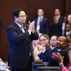 Thủ tướng Phạm Minh Chính và các đại biểu tham dự lễ bế mạc. (Ảnh: Dương Giang/TTXVN)