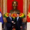 Chủ tịch nước Lương Cường tiếp Thủ tướng Lào Sonexay Siphandone. (Ảnh: Lâm Khánh/TTXVN)