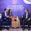 Thủ tướng Phạm Minh Chính gặp Quốc vương Brunei Hassanal Bolkiah. (Ảnh: Dương Giang/TTXVN)