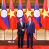 Chủ tịch Quốc hội Trần Thanh Mẫn hội kiến Tổng Bí thư, Chủ tịch nước Lào Thongloun Sisoulith. (Ảnh: Doãn Tấn/TTXVN)