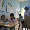 Con em của những cư dân Lào nhập tịch sinh sống ở tỉnh Kon Tum. (Ảnh: Khoa Chương/TTXVN)