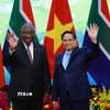 Thủ tướng Phạm Minh Chính hội kiến Tổng thống Cộng hòa Nam Phi Matamela Cyril Ramaphosa. (Ảnh: Dương Giang/TTXVN)