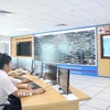 Các cán bộ, kỹ sư tại Phòng Điều độ Công ty Điện lực Ninh Bình trực 24/24 đảm bảo lưới điện vận hành ổn định, thông suốt. (Ảnh: Đức Phương/TTXVN)