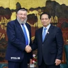 Thủ tướng Phạm Minh Chính tiếp Bộ trưởng Bộ Lao động Nhà nước Israel Yoav Ben Tzur. (Ảnh: Dương Giang/TTXVN)