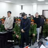 Các bị cáo tại phiên tòa xét xử. (Ảnh: Phạm Kiên/TTXVN)