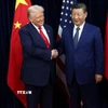 Tổng thống Mỹ Donald Trump (trái) trong cuộc gặp Chủ tịch Trung Quốc Tập Cận Bình tại Busan, Hàn Quốc ngày 30/10/2025. (Nguồn: REUTERS/TTXVN)