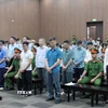 Các bị cáo tại phiên toà xét xử sáng 10/9. (Ảnh: Phạm Kiên/TTXVN)