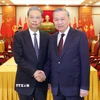 Tổng Bí thư Tô Lâm và Ủy viên trưởng Nhân đại toàn quốc Trung Quốc Triệu Lạc Tế. (Ảnh: Thống Nhất/TTXVN)