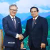 Thủ tướng Phạm Minh Chính tiếp Bộ trưởng Ngoại giao Lào Thongsavanh Phomvihane. (Ảnh: Dương Giang/TTXVN)
