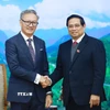 Thủ tướng Phạm Minh Chính tiếp Bộ trưởng Ngoại giao Lào Thongsavanh Phomvihane. (Ảnh: Dương Giang/TTXVN)