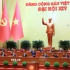 Đại hội biểu quyết thông qua số lượng Ủy viên Ban Chấp hành Trung ương Đảng khóa XIV. (Ảnh: TTXVN)