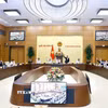Biểu quyết tại một phiên họp của Ủy ban Thường vụ Quốc hội. (Ảnh: Doãn Tấn/TTXVN)