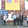 Thứ trưởng Bộ Tài chính Lê Tấn Cận và đoàn công tác tại Lễ bàn giao gạo cho nhân dân Cuba. (Ảnh: Việt Hùng/TTXVN)