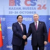 Trong khuôn khổ Hội nghị các Nhà lãnh đạo Nhóm các nền kinh tế mới nổi (BRICS) mở rộng tại Kazan, Liên bang Nga, tối 24/10/2024, Thủ tướng Phạm Minh Chính gặp Tổng thống Liên bang Nga Vladimir Putin, Chủ tịch Nhóm BRICS năm 2024. (Ảnh: Dương Giang/TTXVN)