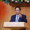 Thủ tướng Phạm Minh Chính chủ trì họp đánh giá kết quả vận hành mô hình chính quyền địa phương hai cấp. (Ảnh: Dương Giang/TTXVN)