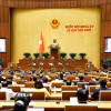 Phó Thủ tướng Thường trực Chính phủ Nguyễn Hòa Bình trình bày Báo cáo về việc thực hiện một số nghị quyết của Quốc hội nhiệm kỳ khóa XIV và khóa XV về giám sát chuyên đề, chất vấn. (Ảnh: Doãn Tấn/TTXVN)