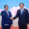 Thủ tướng Phạm Minh Chính và Thủ tướng Lào Sonexay Siphandone đồng chủ trì Kỳ họp lần thứ 48 Ủy ban liên Chính phủ về hợp tác song phương Việt Nam-Lào. (Ảnh: Dương Giang/TTXVN)
