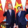 Thủ tướng Phạm Minh Chính hội kiến Ủy viên trưởng Nhân đại toàn quốc Trung Quốc Triệu Lạc Tế. (Ảnh: Dương Giang/TTXVN)