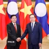 Chủ tịch Quốc hội Trần Thanh Mẫn đón Tổng Bí thư, Chủ tịch nước Lào Thongloun Sisoulith. (Ảnh: Doãn Tấn/ TTXVN)