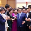 Thủ tướng Phạm Minh Chính gặp mặt đại diện doanh nghiệp nhân Ngày doanh nhân Việt Nam. (Ảnh: Dương Giang/TTXVN)