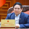 Thủ tướng Phạm Minh Chính chủ trì cuộc họp về mức áp thuế mới của Hoa Kỳ đối với hàng hoá nhập khẩu từ Việt Nam. (Ảnh: Dương Giang/TTXVN)