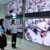 Việc phục vụ người dân đến làm thủ tục hành chính tại Trung tâm phục vụ hành chính công tỉnh Lai Châu luôn được giám sát chặt chẽ. (Ảnh: Việt Dũng/TTXVN)