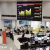 Giao dịch viên tại một công ty chứng khoán ở Tokyo, Nhật Bản. (Ảnh: Kyodo/TTXVN)
