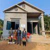 Lễ khánh thành nhà mới hỗ trợ cho hộ ông Lộc Văn Cảo, cựu chiến binh thuộc thôn Hòa Sơn (xã Thuận Hòa, Vị Xuyên, Hà Giang). (Ảnh: Đức Thọ/TTXVN)