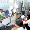Hoạt động tại Trung tâm phục vụ hành chính công phường Vĩnh Phúc, tỉnh Phú Thọ. (Ảnh: Hoàng Hùng/TTXVN)