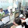 Hoạt động tại Trung tâm phục vụ hành chính công phường Vĩnh Phúc, tỉnh Phú Thọ. (Ảnh: Hoàng Hùng/TTXVN)