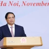 Thủ tướng Phạm Minh Chính chủ trì Hội nghị tham vấn các chuyên gia, tổ chức trong nước và quốc tế về thành lập Trung tâm tài chính quốc tế tại Việt Nam. (Ảnh: Dương Giang/TTXVN)