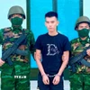Đối tượng Lê Phú Nghĩa bị bắt giữ khi đang làm thủ tục nhập cảnh từ Campuchia về Việt Nam. (Ảnh: TTXVN phát)