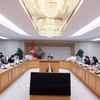 Phó Thủ tướng Trần Hồng Hà chủ trì họp nghe báo cáo về việc phê duyệt tổng hạn ngạch phát thải khí nhà kính cho năm 2025-2026. (Ảnh: Văn Điệp/TTXVN)