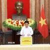 Chủ tịch nước Lương Cường quyên góp, ủng hộ đồng bào khắc phục hậu quả cơn bão số 10. (Ảnh: Lâm Khánh/ TTXVN)