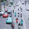 Xe điện với nhiều ưu điểm, tiện lợi nên ngày càng hiện diện nhiều trong đời sống hàng ngày của người dân. (Ảnh: Hoàng Hiếu/TTXVN)