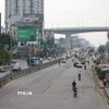 Xe cộ di chuyển thuận lợi qua tuyến đường Giải Phóng. (Ảnh: Thanh Tùng/TTXVN)