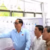 Phó Chủ tịch Quốc hội Trần Quang Phương kiểm tra, giám sát khu vực bỏ phiếu khu phố 3, Tổ bầu cử số 68, Đơn vị bầu cử số 6, phường Rạch Giá (tỉnh An Giang). (Ảnh: Văn Sỹ/TTXVN)