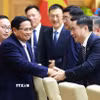 Thủ tướng Phạm Minh Chính với các doanh nghiệp Trung Quốc tham dự tọa đàm. (Ảnh: Dương Giang/TTXVN)