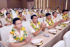 Các điển hình tiên tiến trong lực lượng Công an nhân dân tại buổi gặp mặt. (Ảnh: Phạm Kiên/TTXVN)