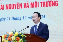 Bộ trưởng Bộ Tài nguyên và Môi trường Đỗ Đức Duy phát biểu tại hội nghị. (Ảnh: HV/Vietnam+)