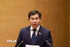 Ủy viên Ủy ban Thường vụ Quốc hội, Tổng Thư ký Quốc hội - Chủ nhiệm Văn phòng Quốc hội Lê Quang Mạnh trình bày dự thảo Nghị quyết Kỳ họp thứ nhất. (Ảnh: Tuấn Anh/TTXVN)