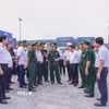 Đoàn công tác Bộ Tư lệnh Bộ đội Biên phòng và lãnh đạo tỉnh Tây Ninh khảo sát thực tế công tác phân luồng giao thông và kiểm tra giám sát hàng hóa xuất nhập khẩu tại Cảng cạn Tân Cảng-Mộc Bài. (Ảnh: Minh Phú/TTXVN)