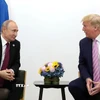 Tổng thống Mỹ Donald Trump (phải) trong cuộc gặp Tổng thống Nga Vladimir Putin tại Helsinki (Phần Lan) ngày 16/7/2018. (Ảnh: THX/TTXVN)