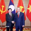 Tổng Bí thư Tô Lâm và Tổng Bí thư, Chủ tịch nước Lào Thongloun Sisoulith. (Ảnh: Phương Hoa/TTXVN)