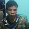Đối tượng Điểu Trung bị bắt. (Ảnh: TTXVN phát)