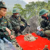Đội tìm kiếm, quy tập hài cốt liệt sỹ quy tập thành công 3 hài cốt liệt sỹ tại điểm cao A5 (xã Thanh Thủy, Tuyên Quang). (Ảnh: Đức Thọ/TTXVN)