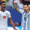 Jude Bellingham đối đầu Lionel Messi. (Ảnh: AFP/TTXVN)